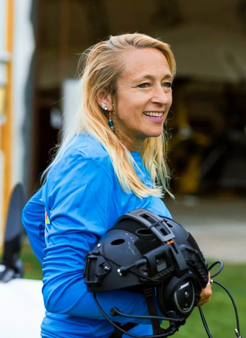 Heather Chirtea, the nation's first female flying car pilot holding flying car helmet.