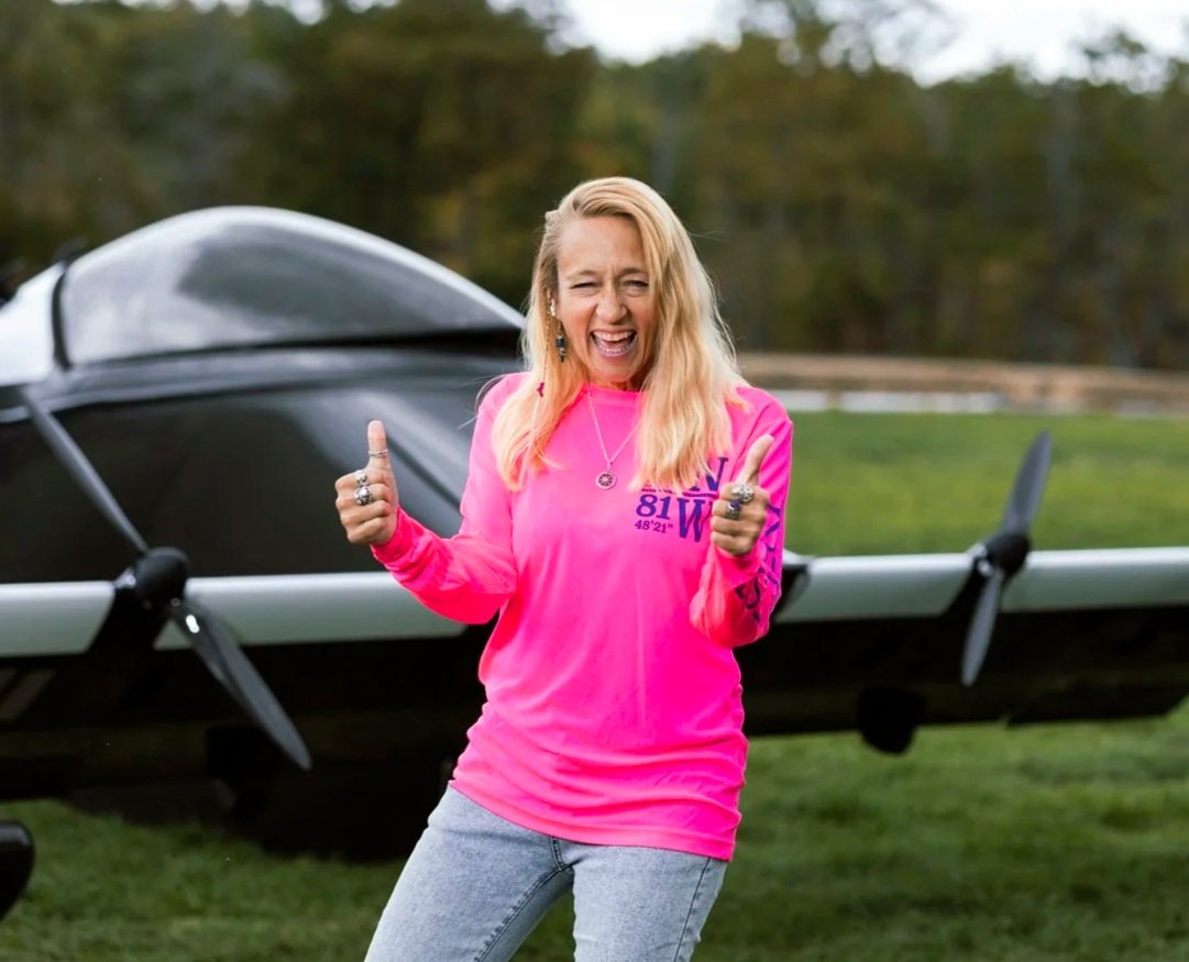 Heather Chirtea, the nation's first female flying car pilot, hangs out in front of the nation's first flying car, the BlackFly.