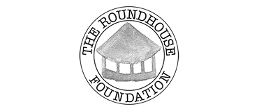 Logo of the Groundhouse Foundation featuring a circular design with a house illustration inside.
