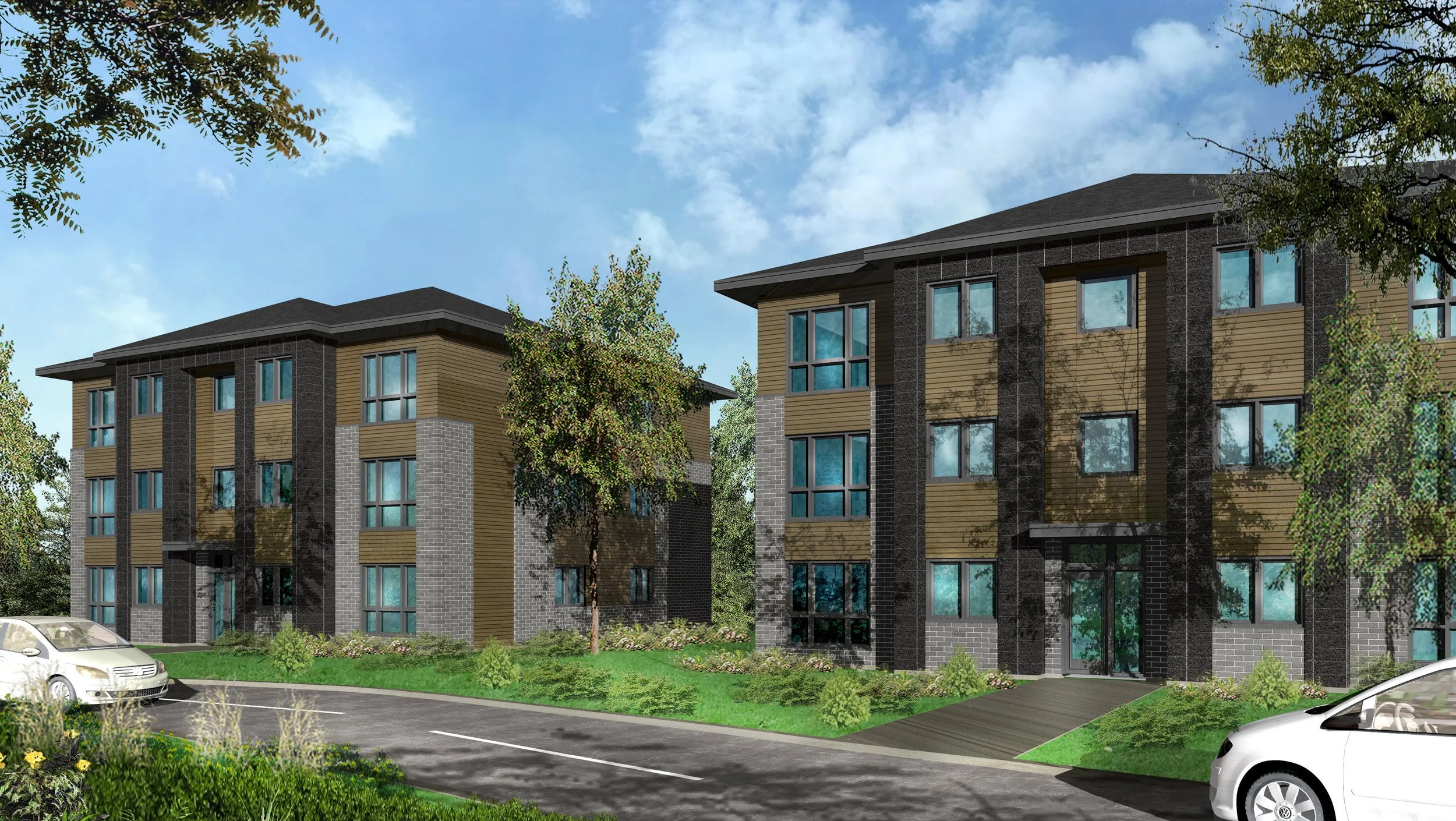 Deux immeubles résidentiels modernes en pierre et bois, entourés d'arbres et de verdure, avec une route et des voitures devant.