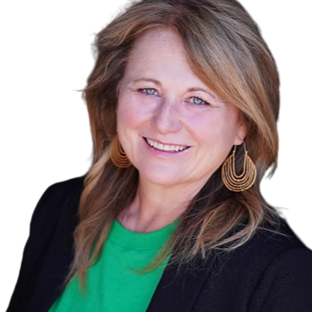 A woman with shoulder-length light brown hair, wearing a black blazer, green top, and large gold earrings, smiling in front of a plain background.