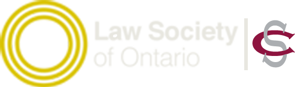 A close-up of a yellow electronic device with a white and purple component attached.