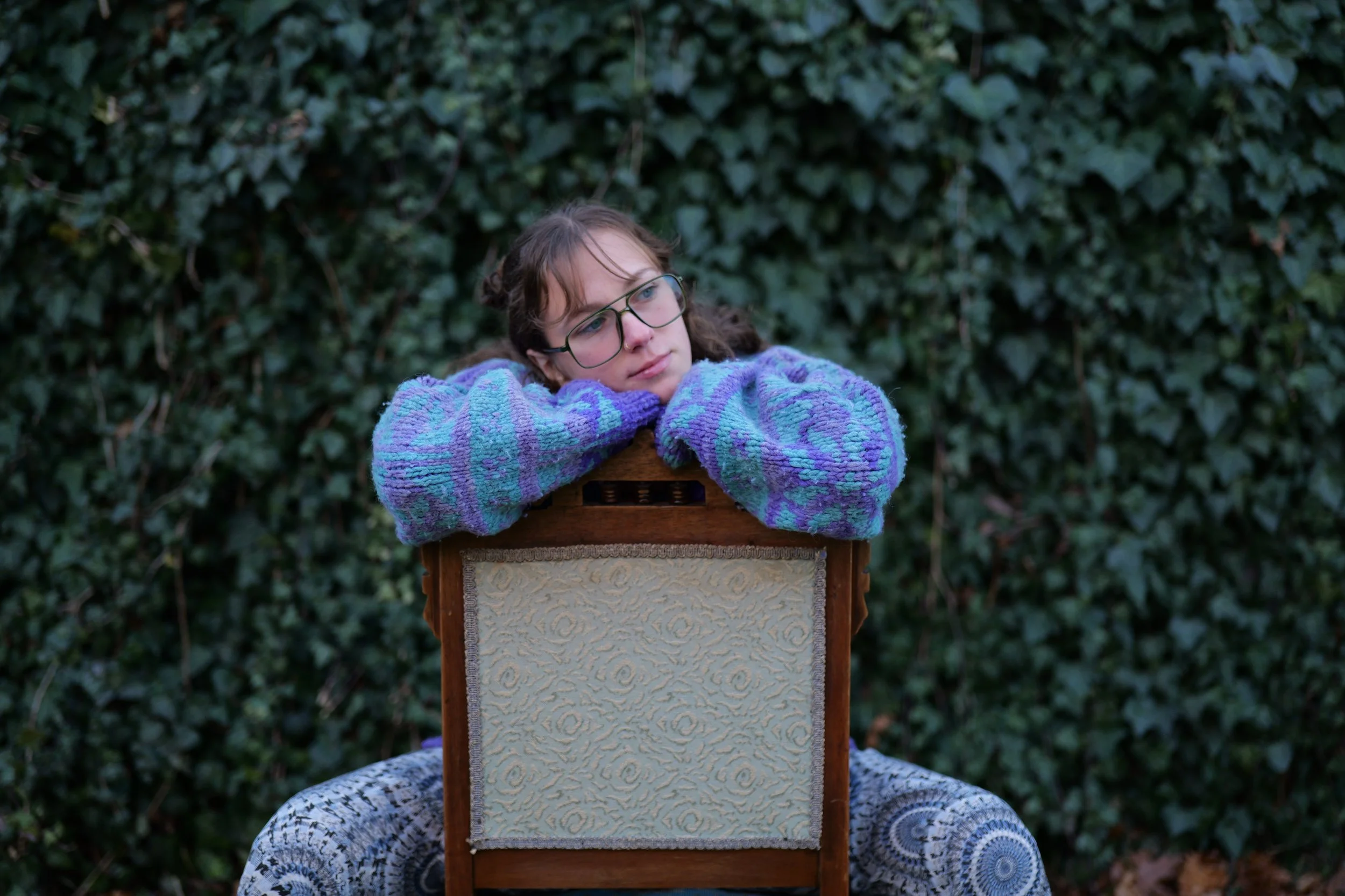 backwards chair sit. pensive.