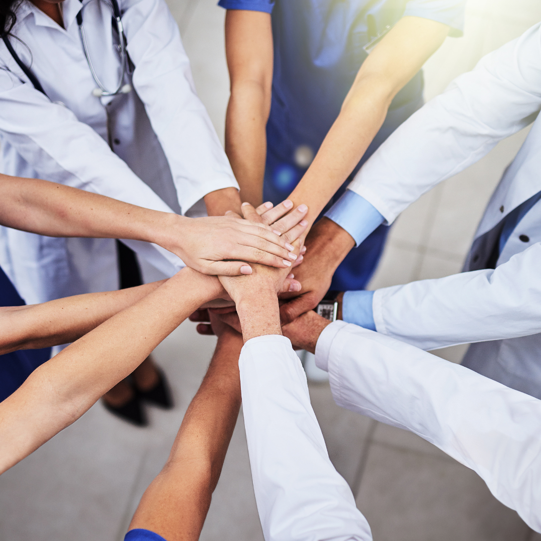 Medical professionals engaged in collaborative learning and mentorship