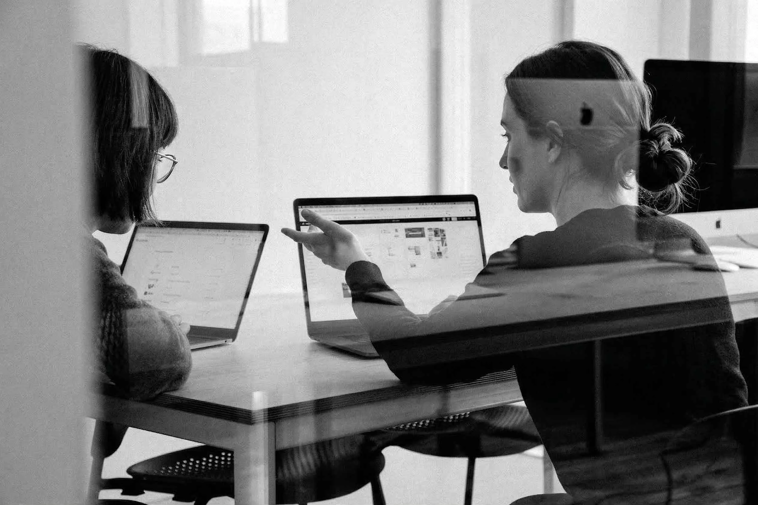 Collaborative executive coaching session focusing on strategic decision-making and leadership development.