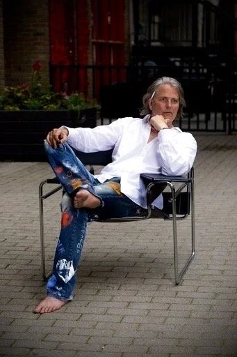 Bex seated on a Breuer or Kandinsky chair...