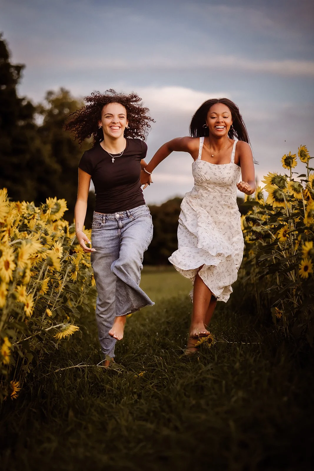 Senior portrait in sunflower field with best friend.