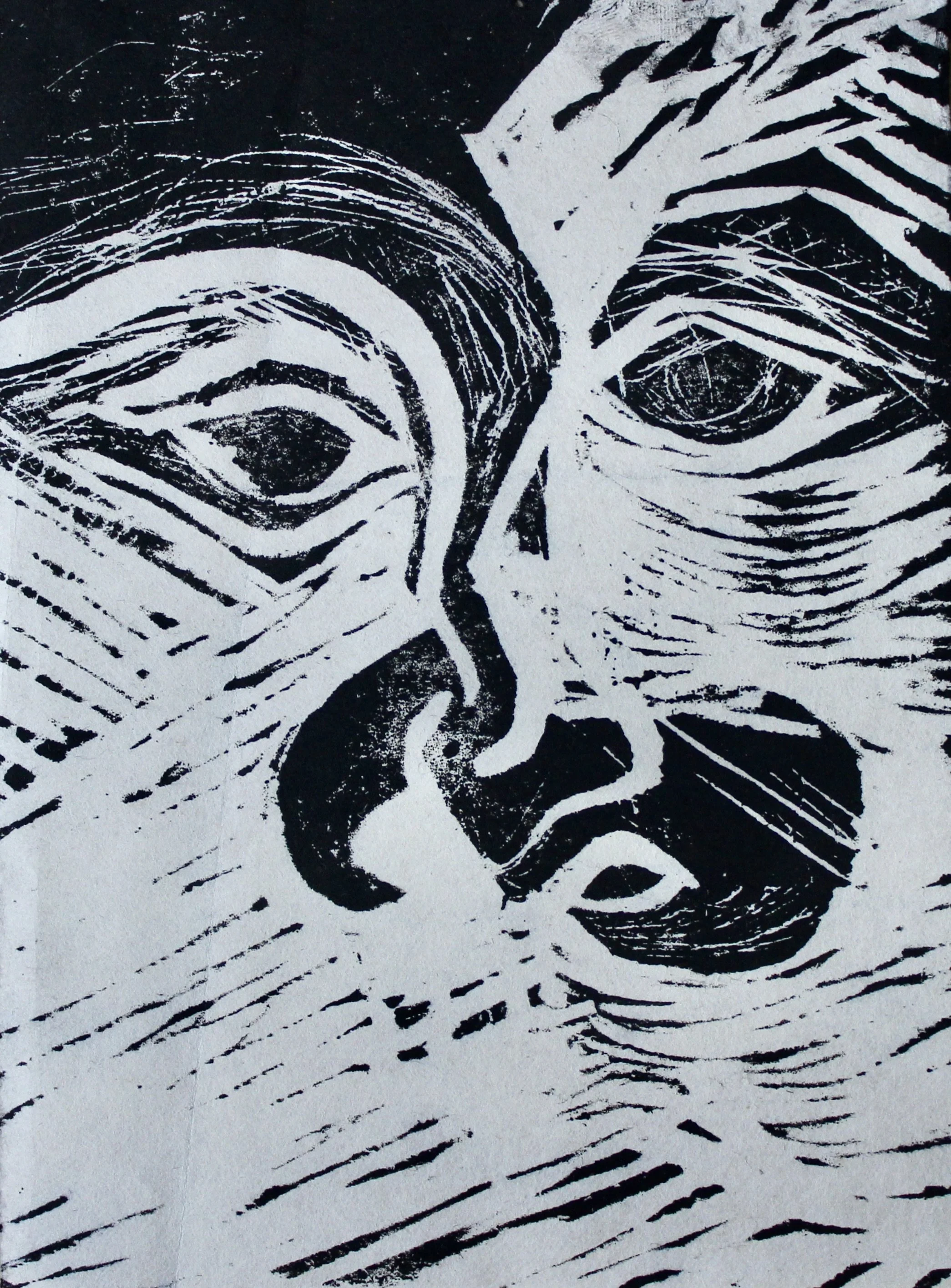 Black and white linocut print of a face with intertwined lines, prominent eyes, nose, and mouth.