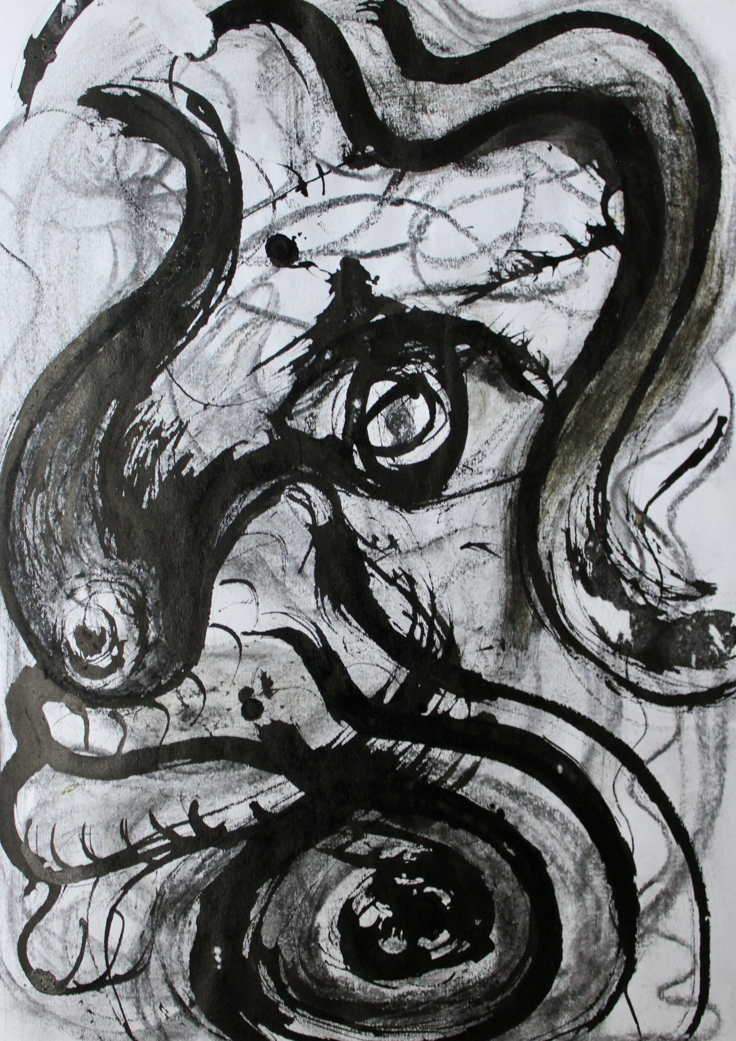 Abstract black ink expressionist art on white paper featuring swirling lines, circles, and bold strokes.