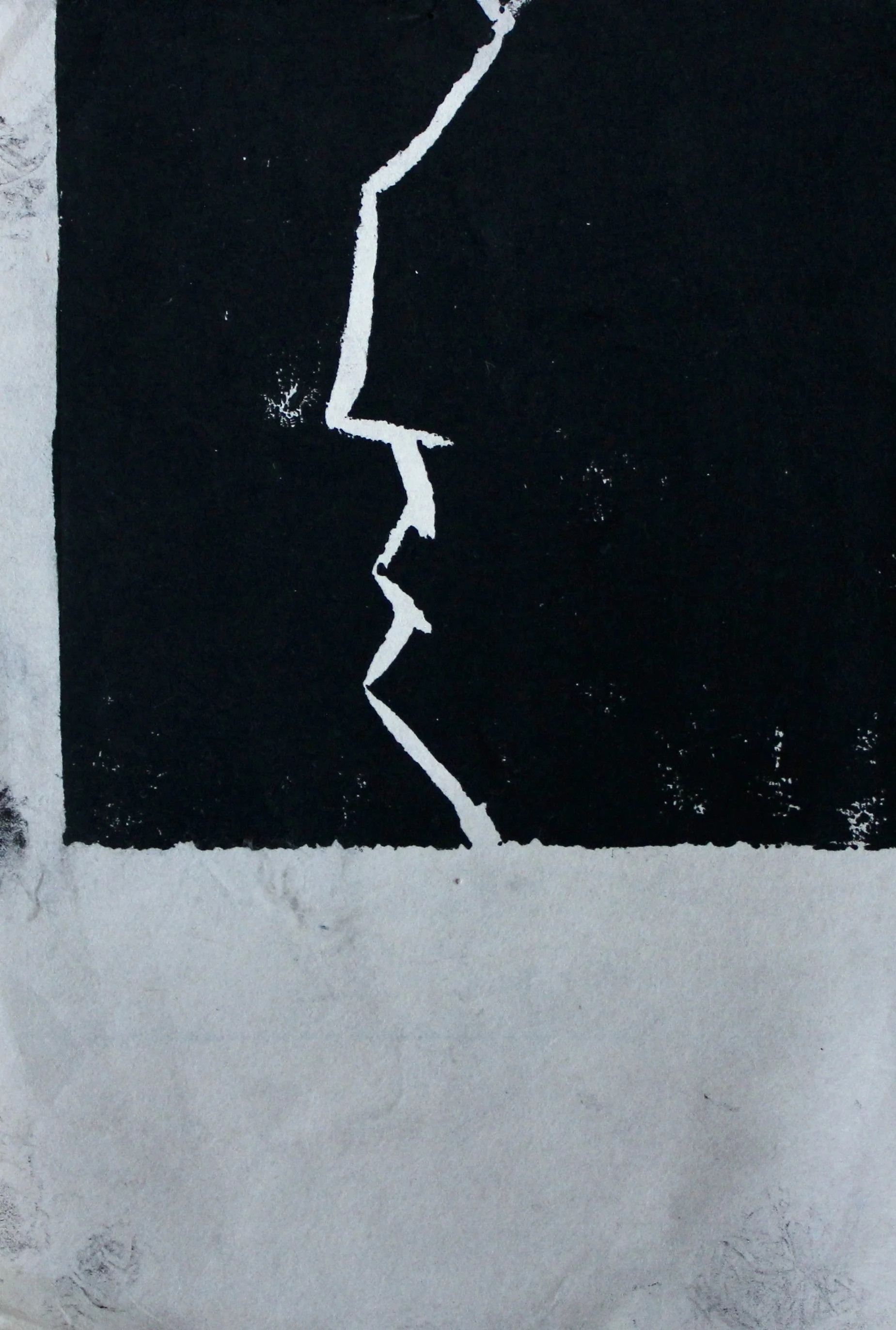 A black background with a white, jagged, crack-like line running vertically through the middle.
