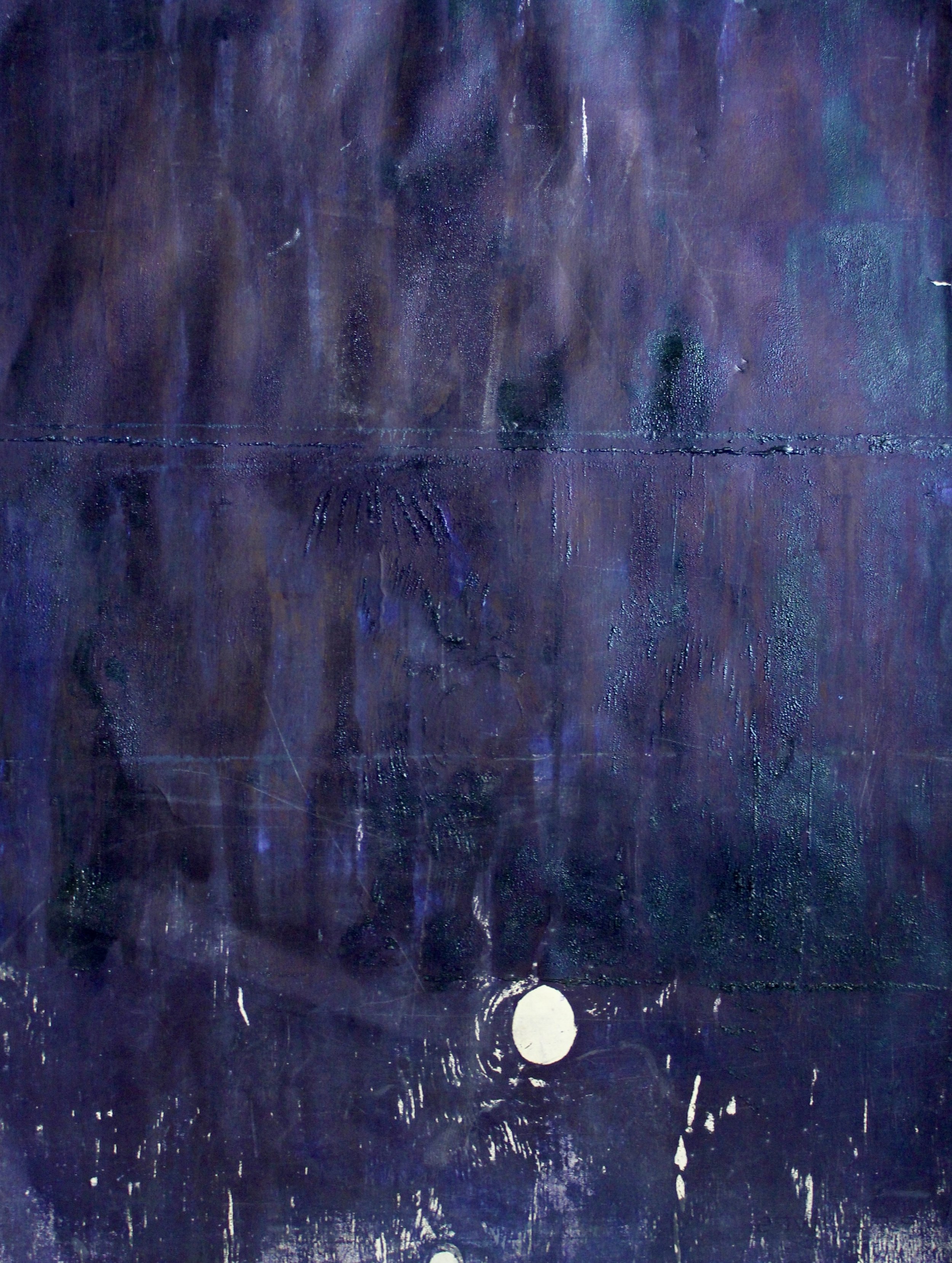 Close-up of a dark, textured surface with purple and blue hues, showing faint, weathered patterns and water droplets.