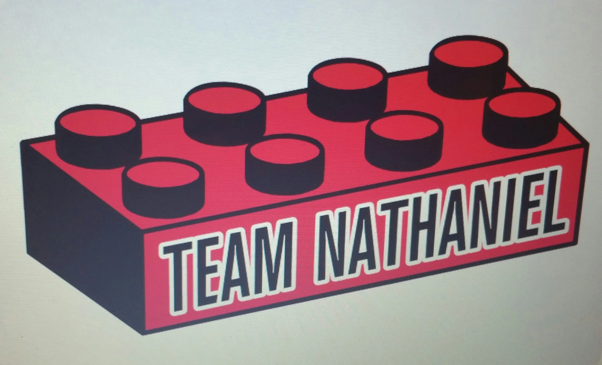 An illustration of a red and black toy brick with the words 'TEAM NATHANIEL' written on it.