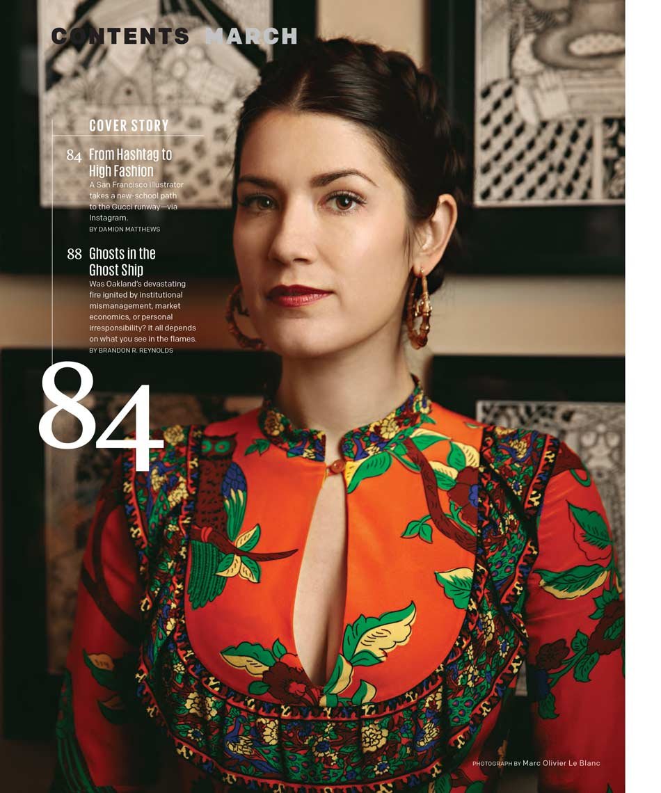Magazine cover featuring a young woman with short dark hair, wearing red and multicolored floral traditional attire, and earrings. The cover lists articles titled 'From Hashtag to High Fashion' and 'Ghosts in the Ghost Ship.'