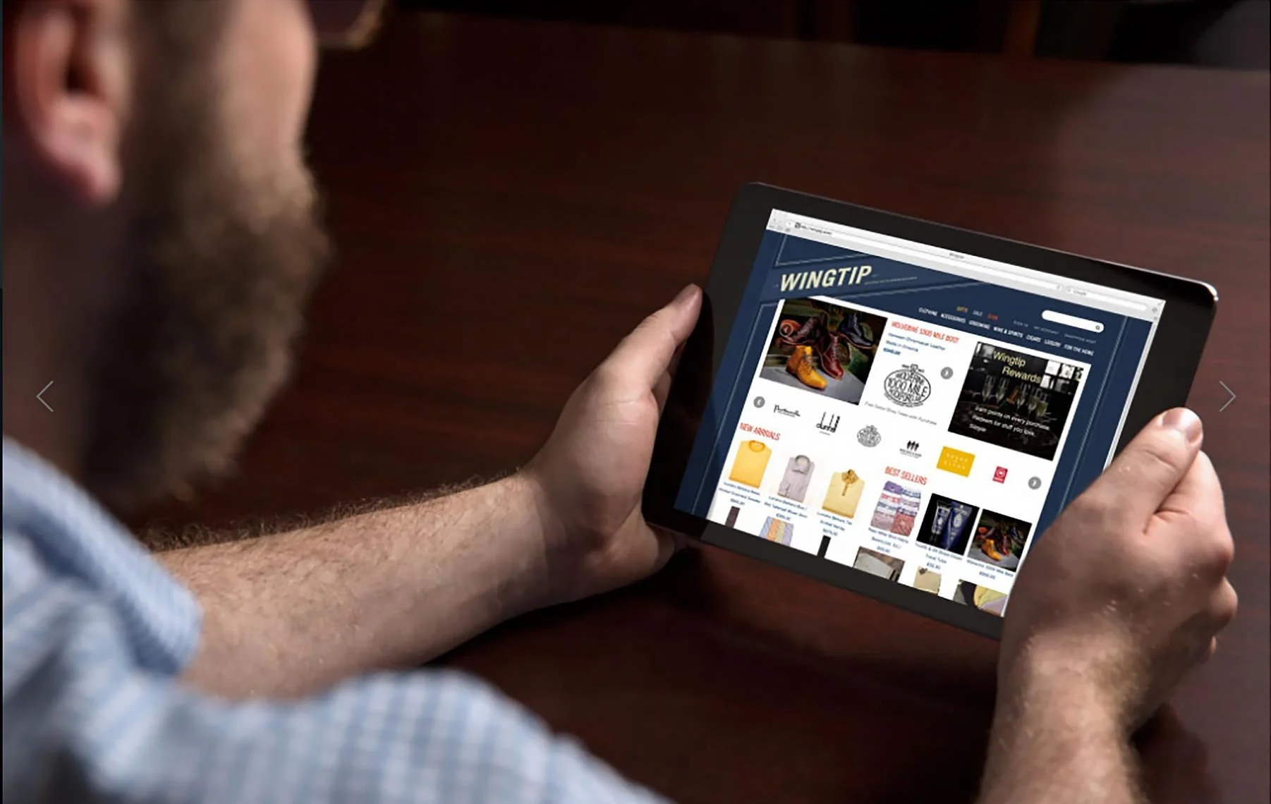 Advertising photo of a bearded man browsing the Wingtip e-commerce site on a tablet, San Francisco – Marc Olivier Le Blanc Photography