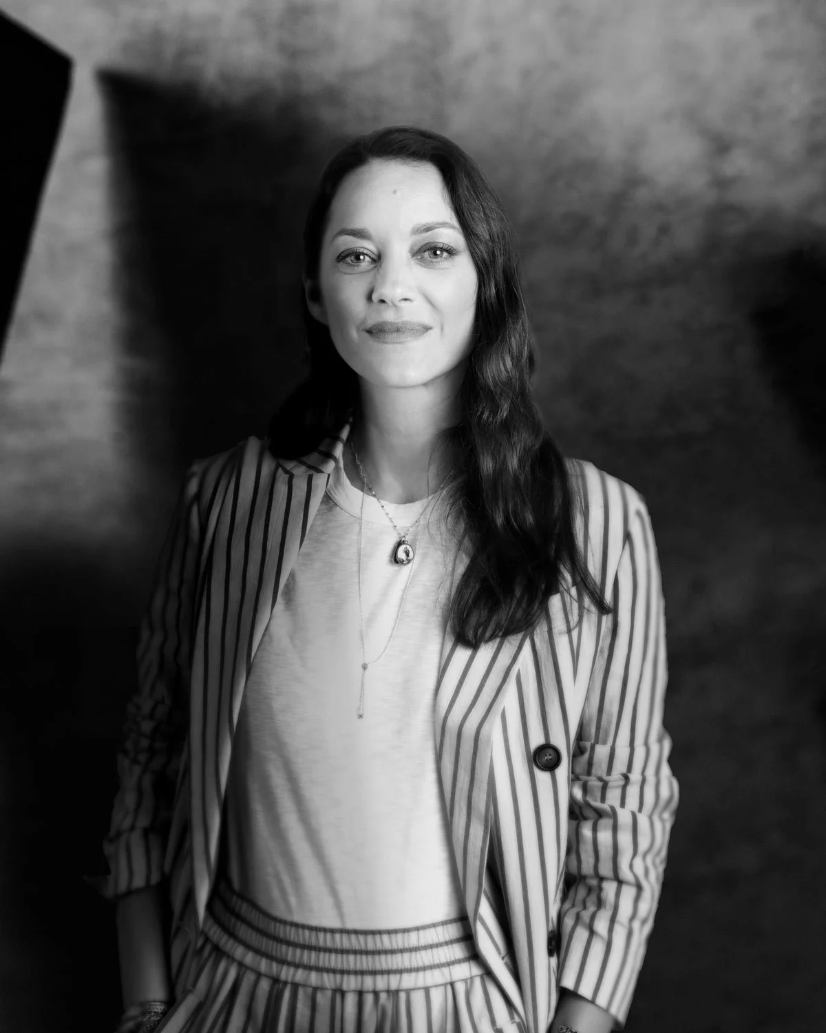 Black and white portrait of Marion Cotillard in a striped suit — San Francisco portrait by Marc Olivier Le Blanc