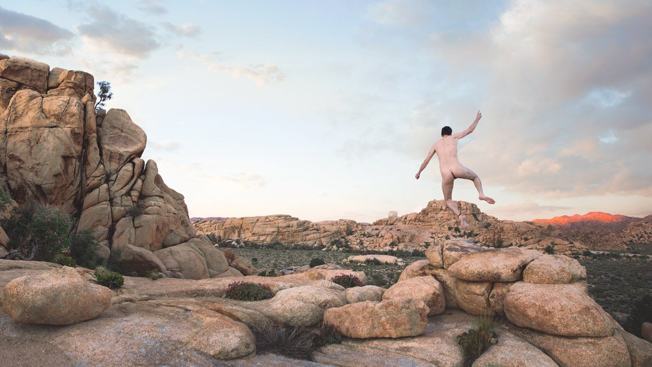 Self-portrait of Marc Olivier Le Blanc jumping at Joshua Tree National Park in morning light