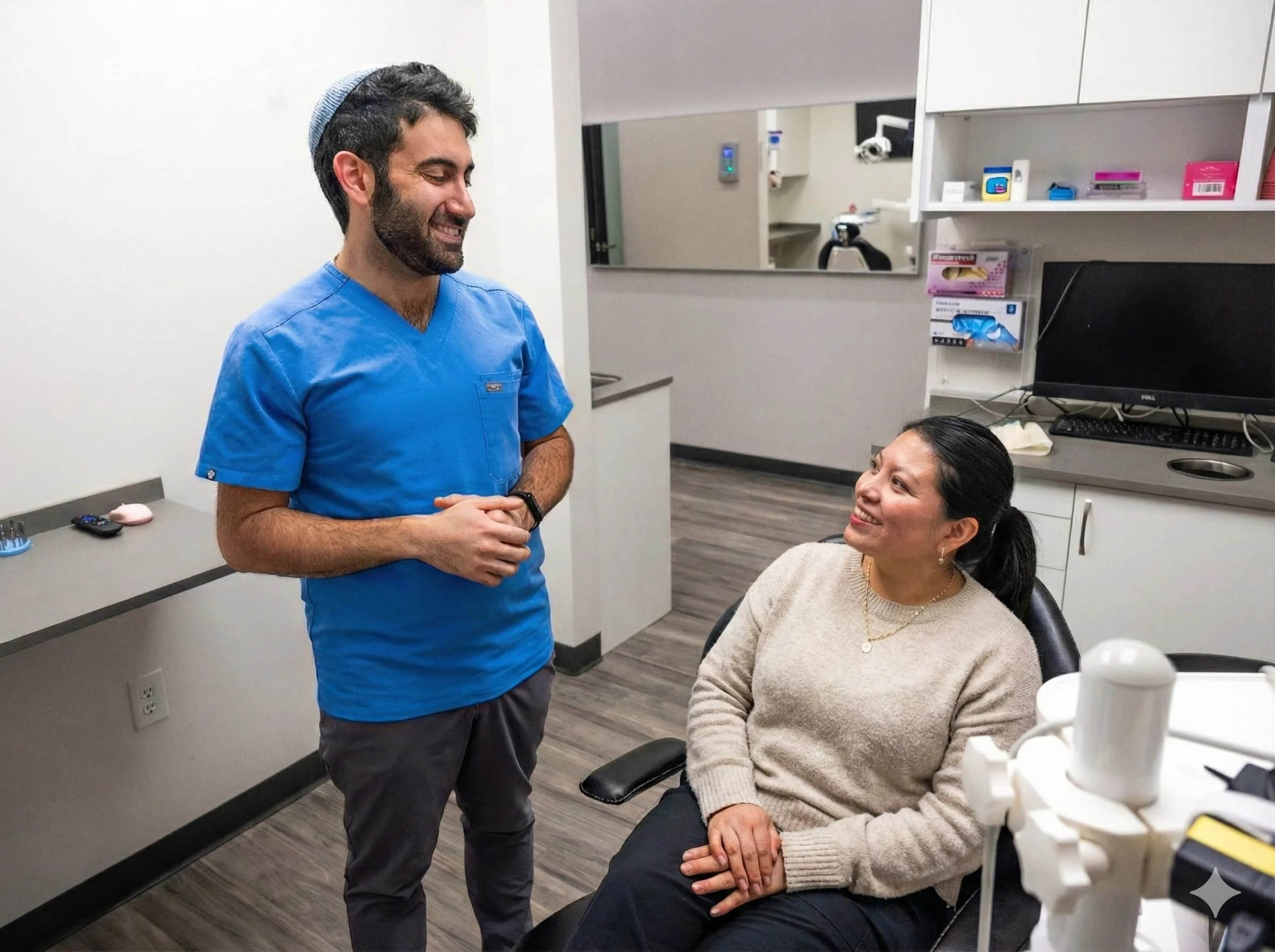 Dr. Joshua Ishal talking with a patient at Luna Dental