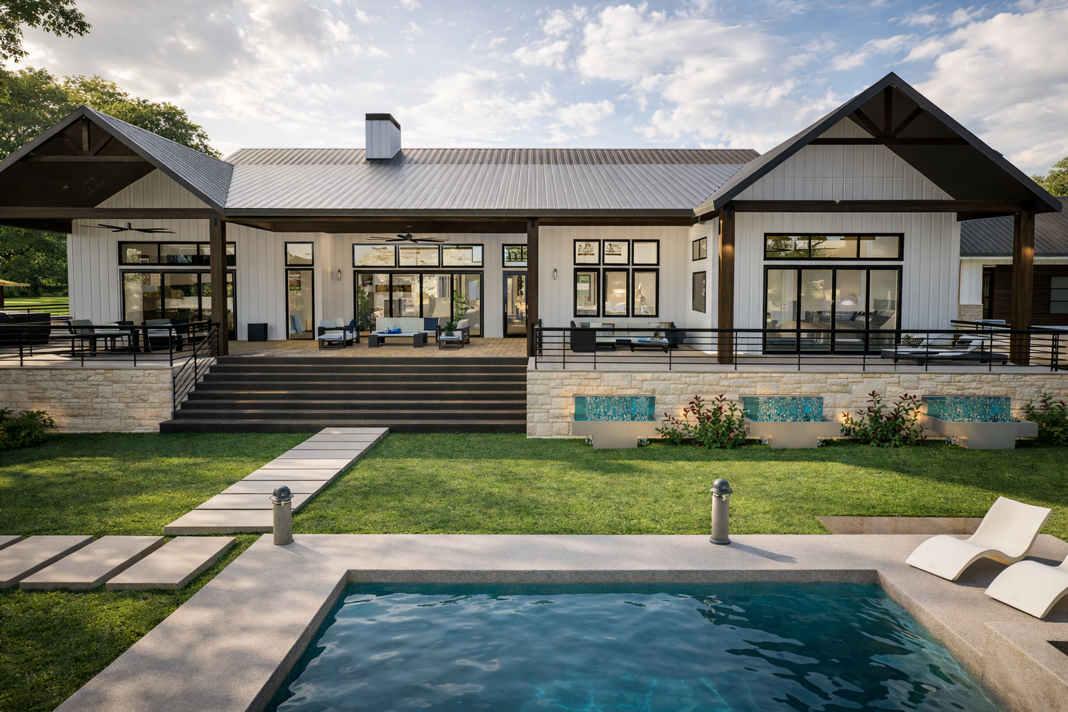 Modern house with large windows and a backyard swimming pool with lounge chairs, landscaped grass, and decorative tiles