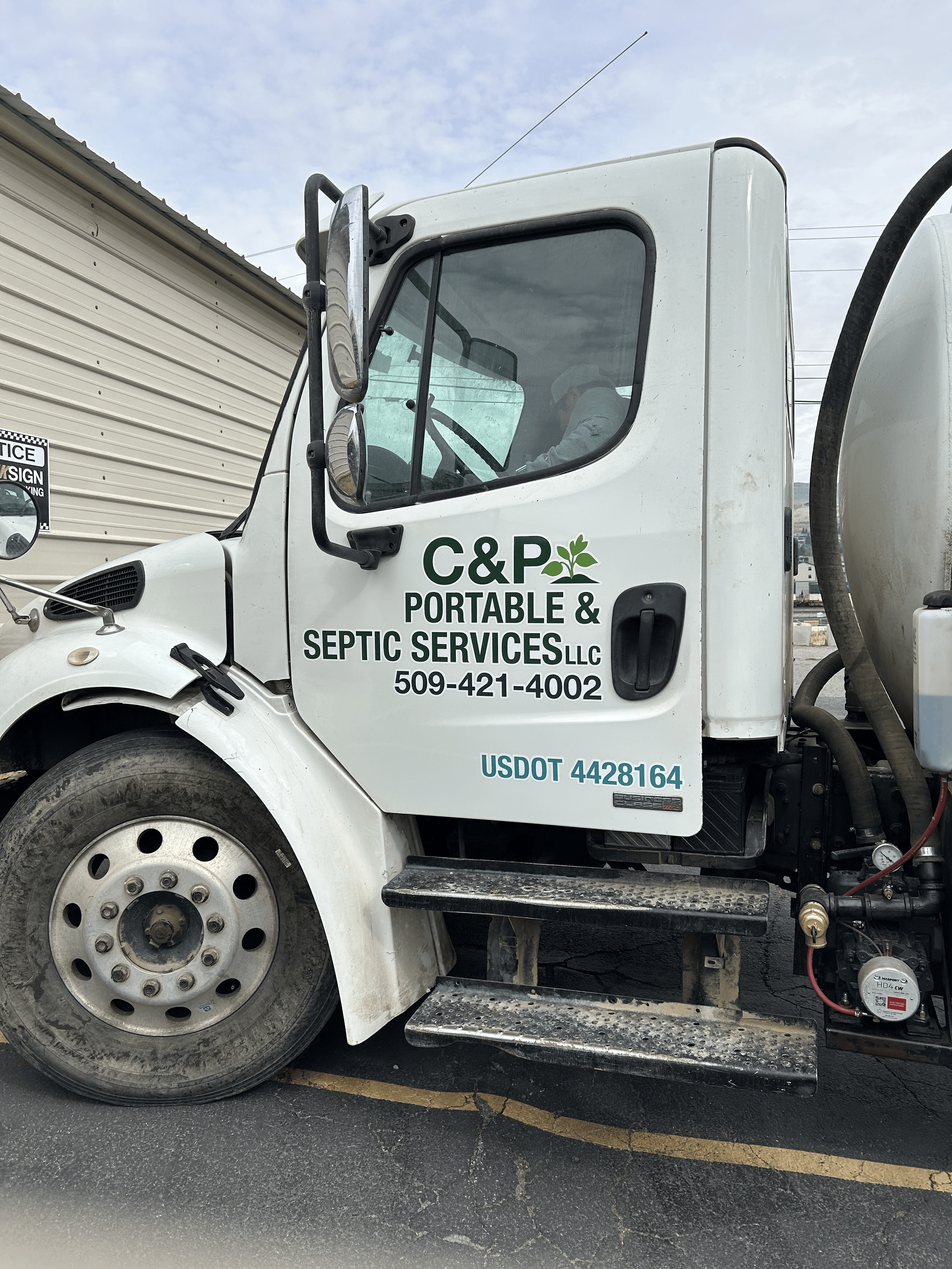 Large white truck with C&P Portable and Septic Services logo.