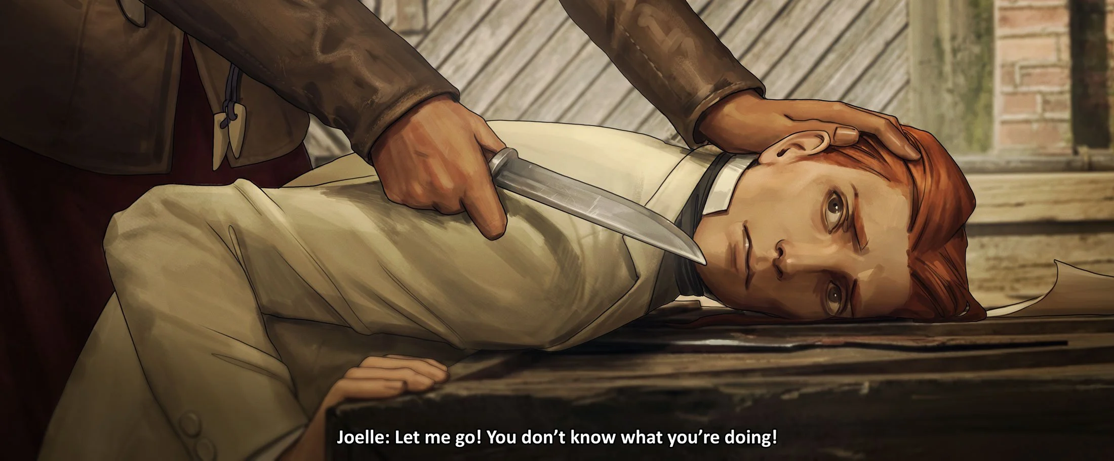 A young man held down at knifepoint