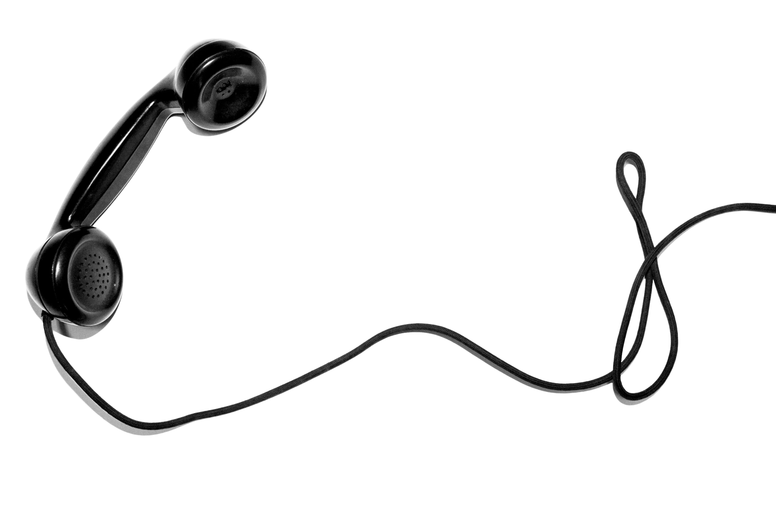 Black handheld telephone receiver connected to a coiled cord