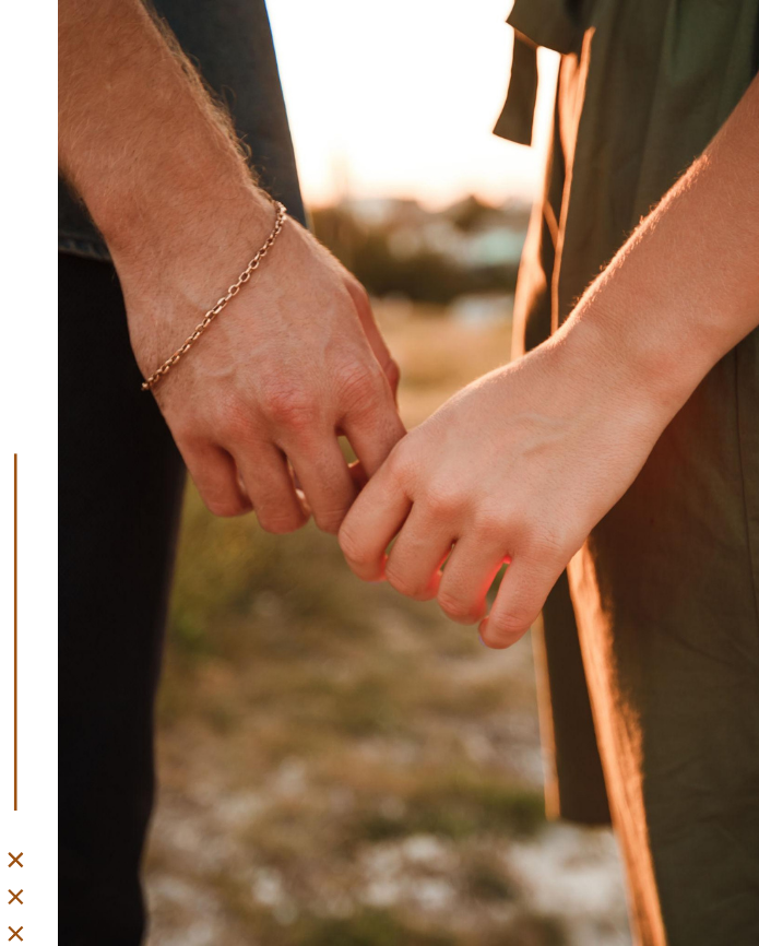 Couple holding hands, representing connection and relationship support