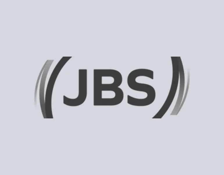 Kate Dillon client logo 'JBS' on a light gray background.