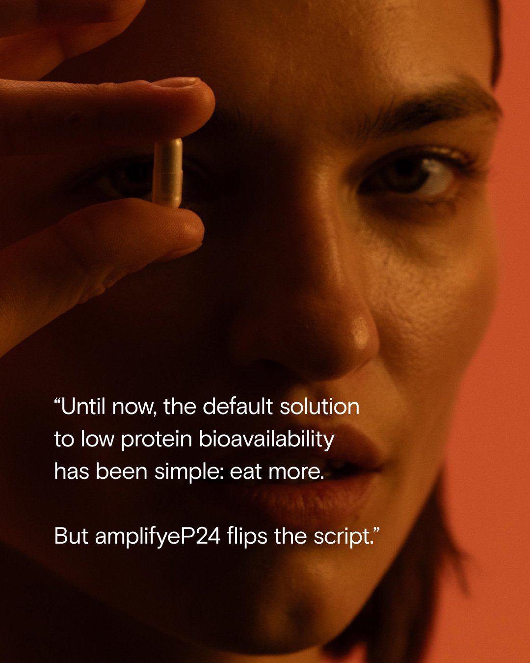 Creative campaign for P24 with an image of a woman holding a capsule of P24 up close to her face