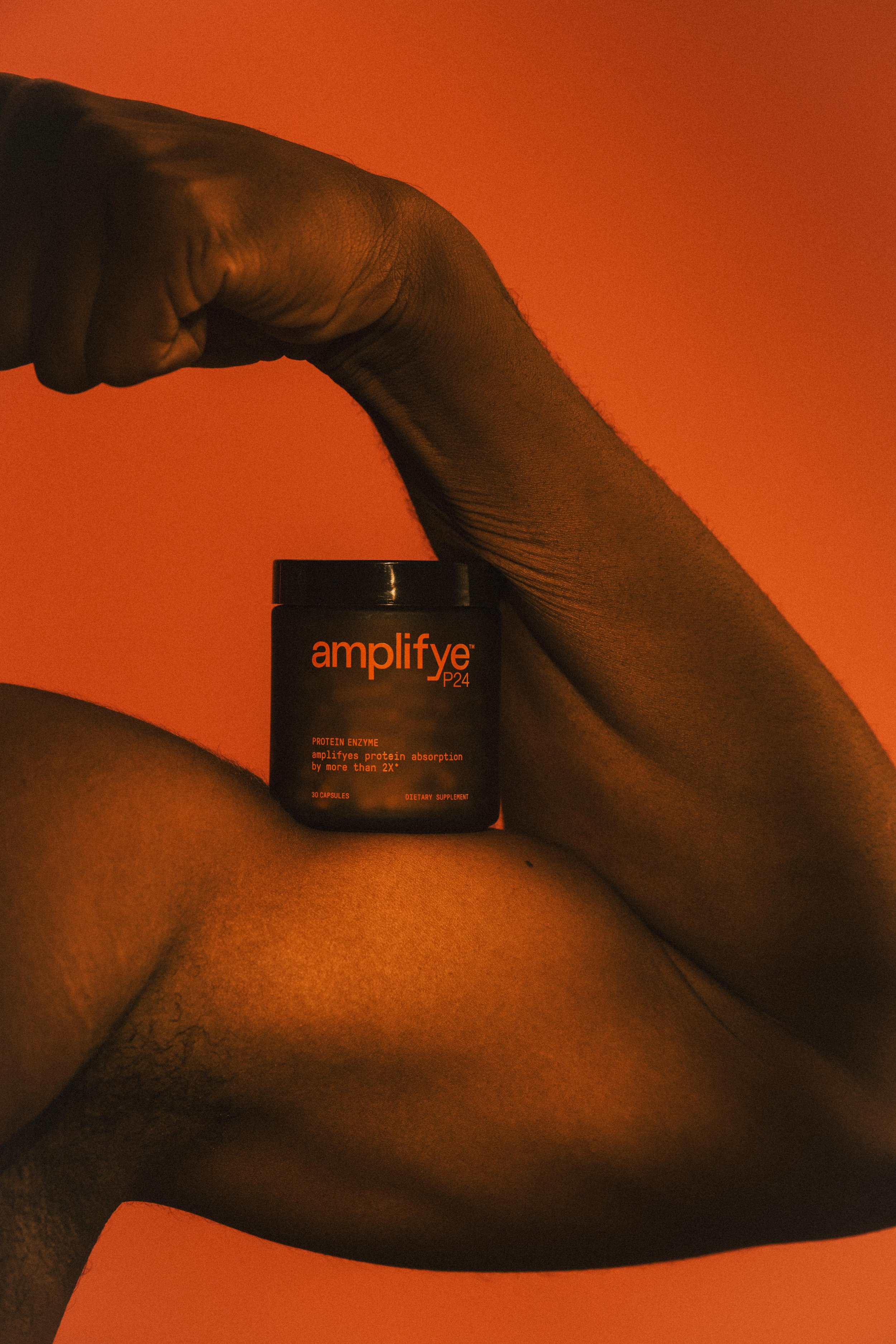Creative campaign for AmplifyeP24 shows a muscular male arm holding a bottle of P24 | Content Strategy and Creative Direction provided by Mary Joan Cunningam