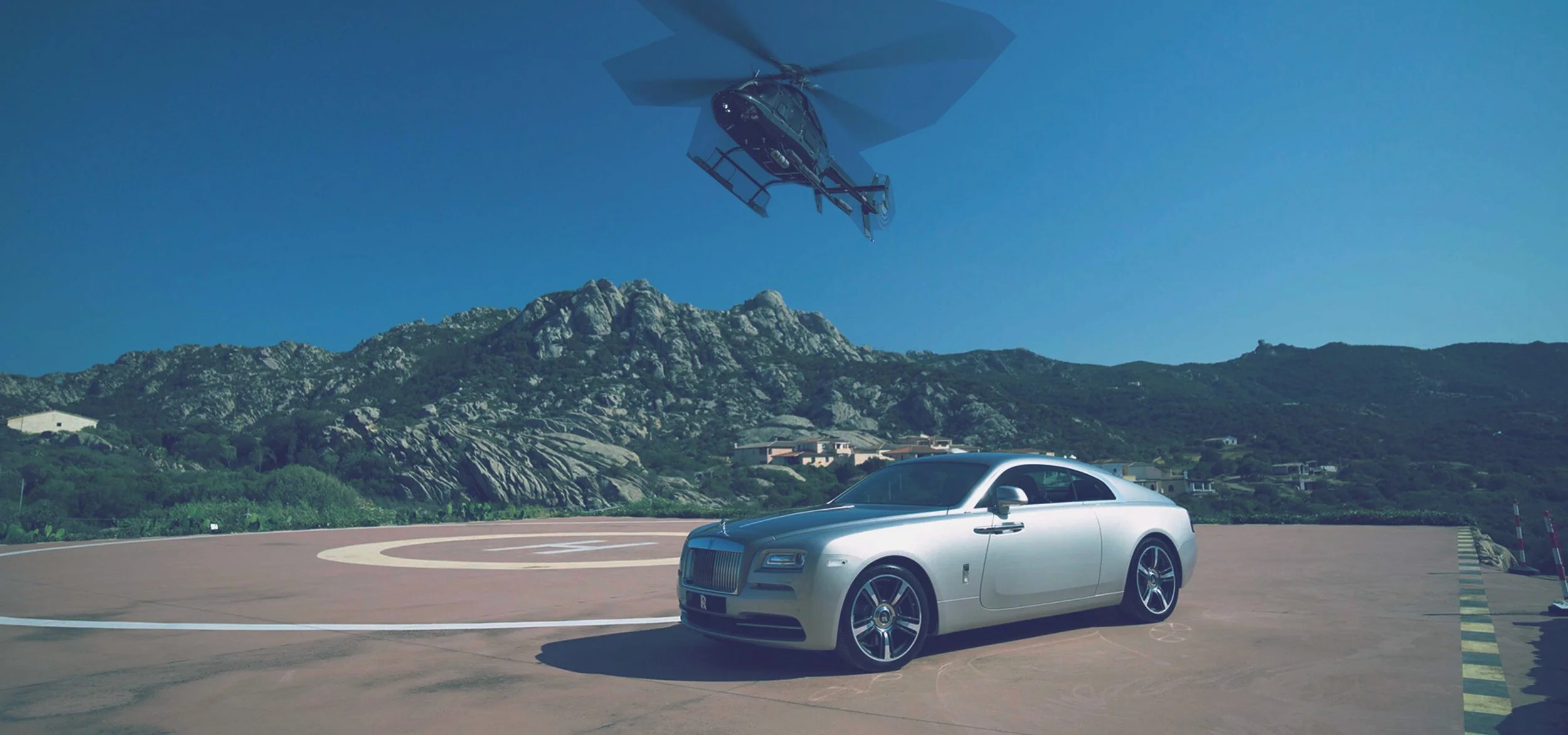 Rolls Royce car against scenic background