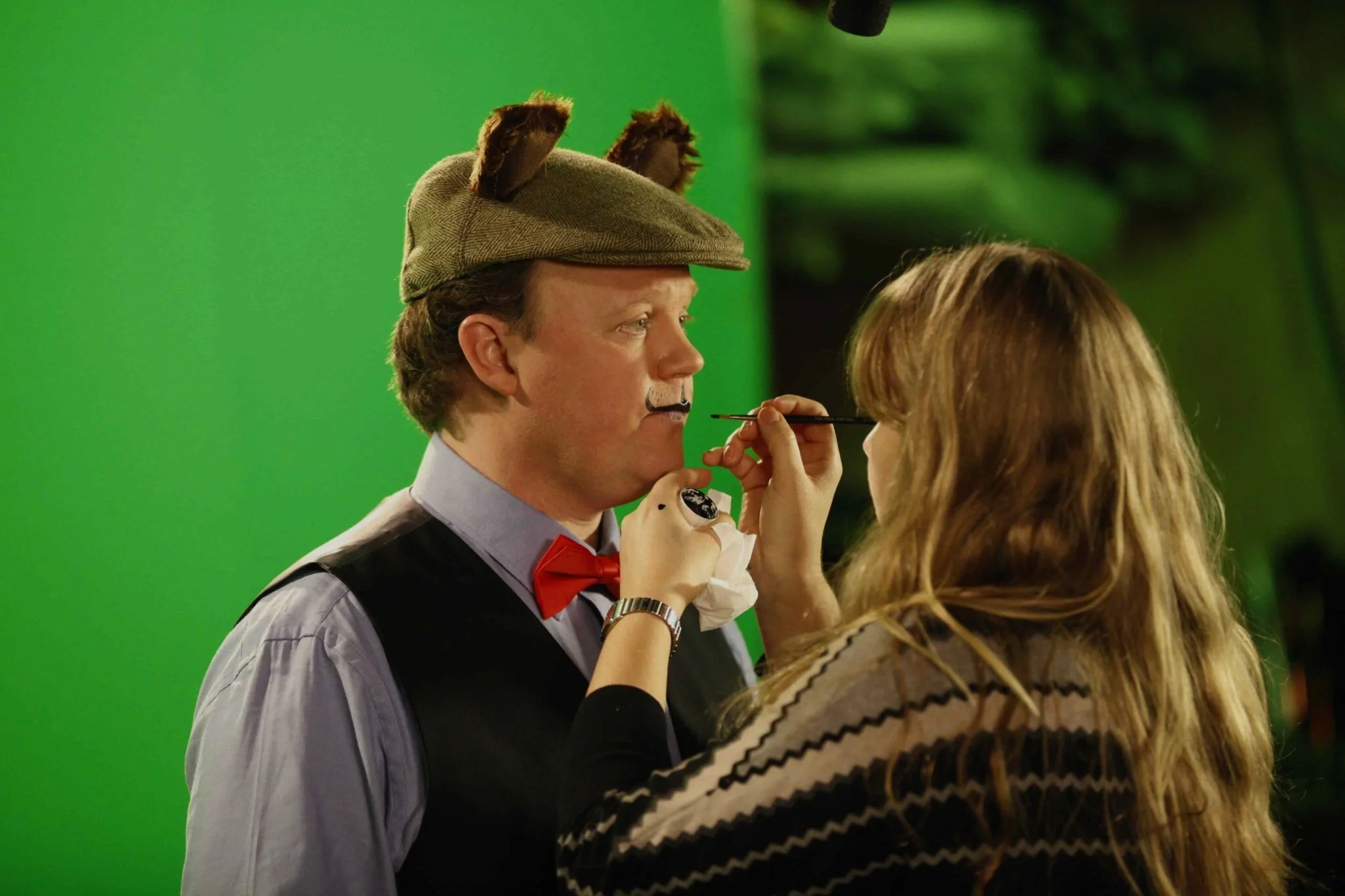 Mr Tumble getting his make up done