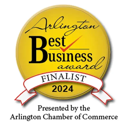 Gold circular badge with black text and a red checkmark, reading 'Arlington Best Business Award Finalist 2024,' presented by the Arlington Chamber of Commerce