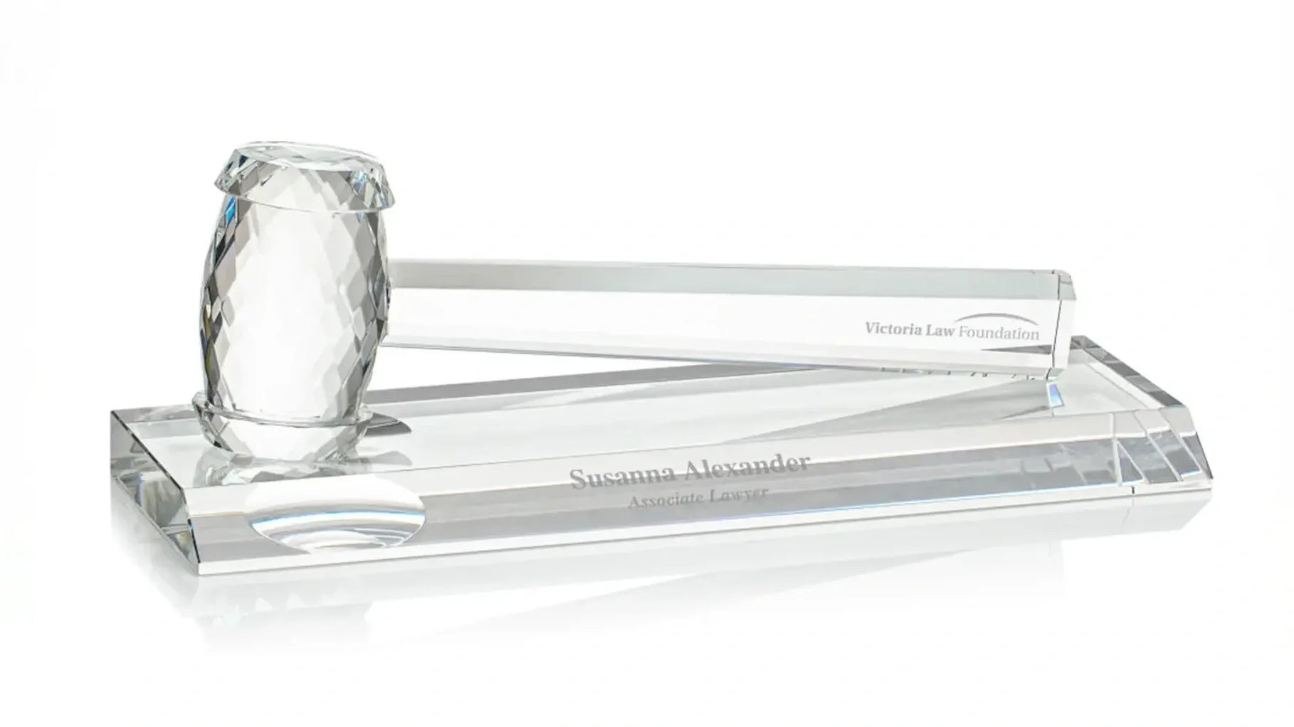 A custom engraved glass crystal award, judge's mallet, or gavel