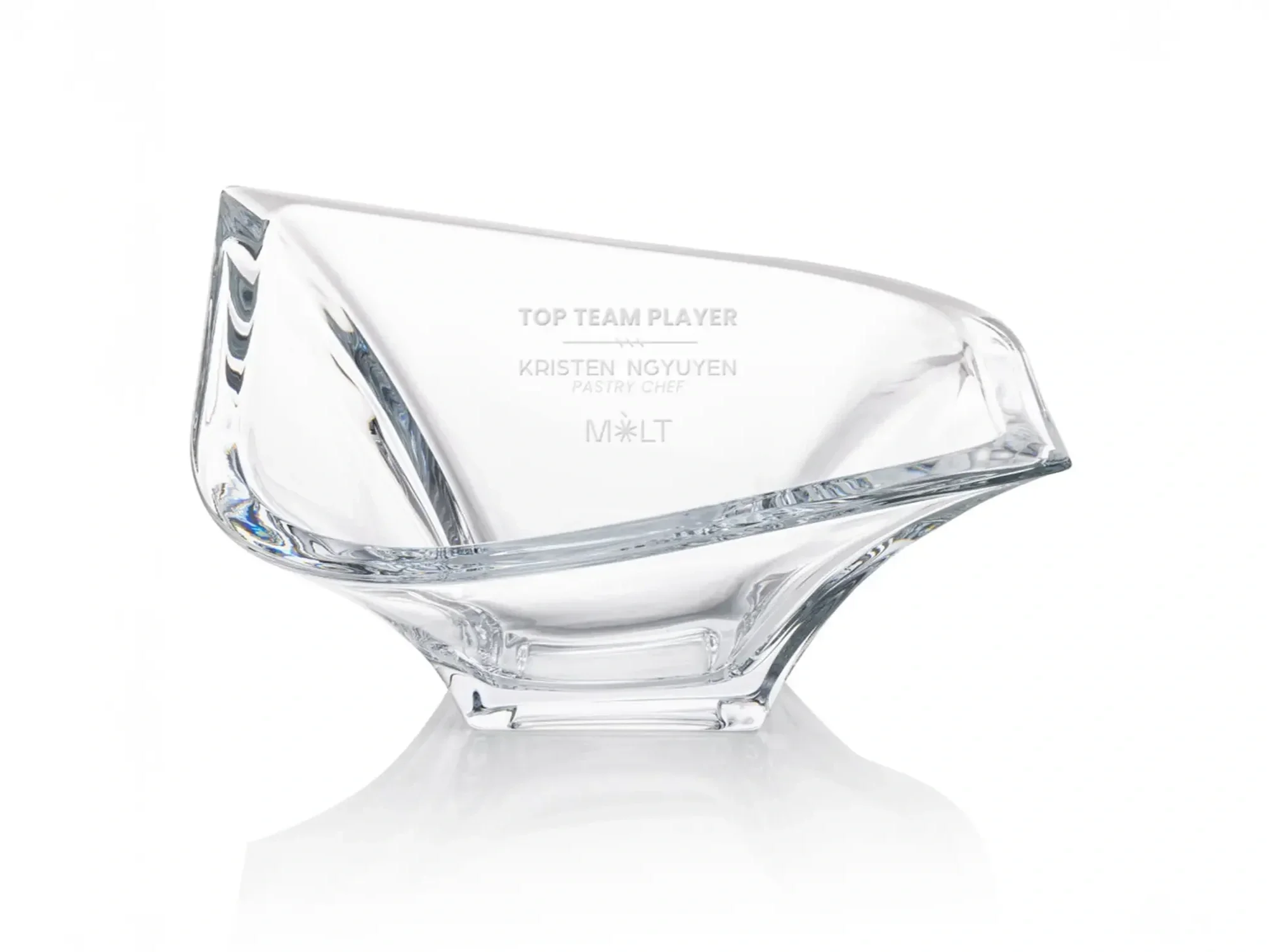 Clear glass crystal award bowl with engraved text in a modern, angled design