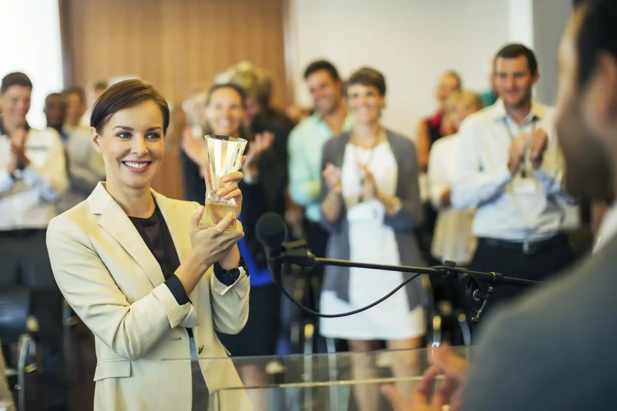Manager gifting employee a glass crystal award
