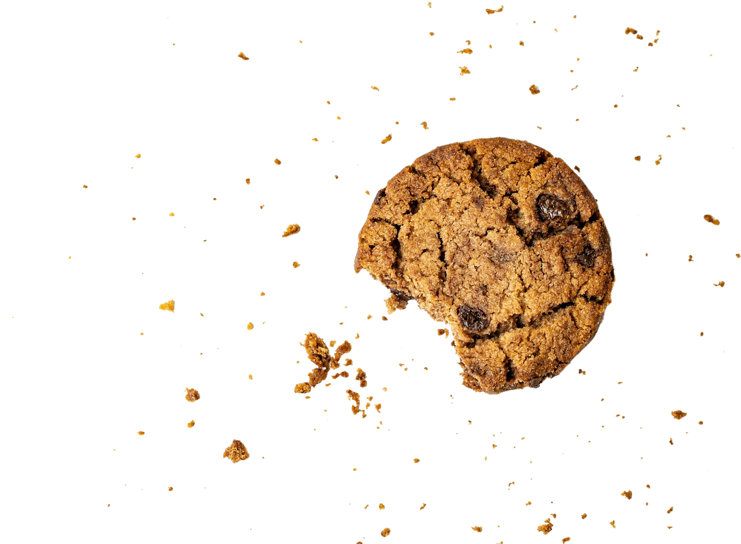 A chocolate chip cookie with a bite taken out, lying on a white surface, with cookie crumbs scattered around.