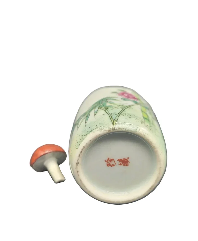 19th-century Chinese snuff bottle is crafted from fine Famille Rose porcelain.