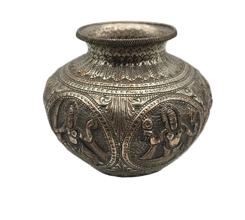 A 19th-century Oriental white metal jar or vase is a striking example of antique metalwork, notable for both its substantial weight and fine hand decoration.