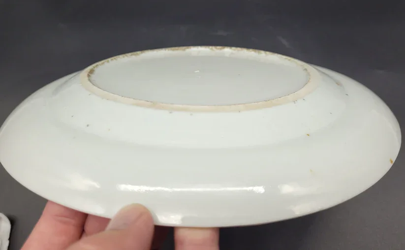 Foot of a Chinese shallow bowl or plate dates to the late 18th – early 19th century and is a stunning example of Famille Rose porcelain artistry.