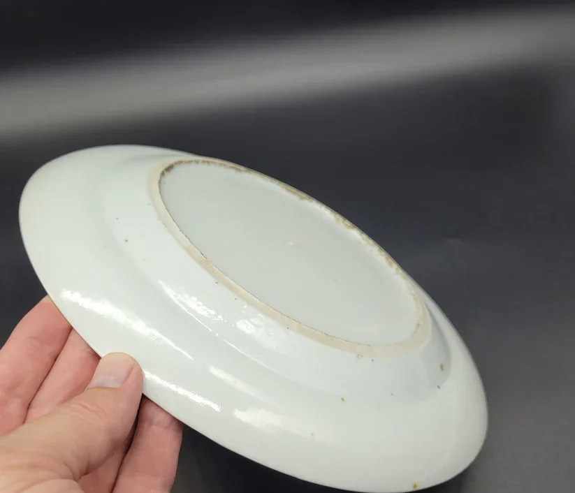 Back of a Chinese shallow bowl or plate dates to the late 18th – early 19th century and is a stunning example of Famille Rose porcelain artistry.