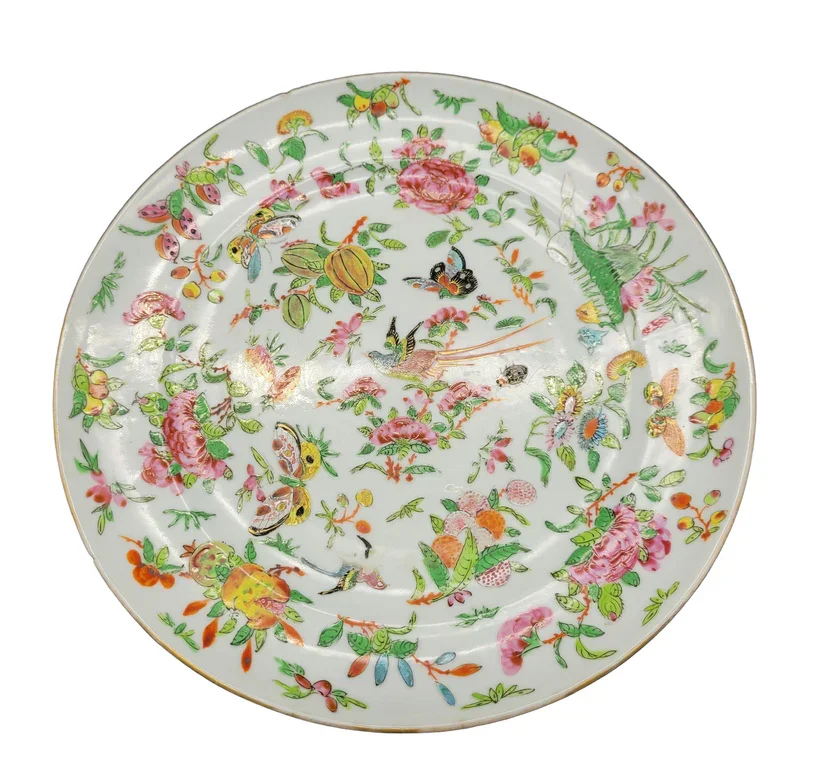 Top view of a Chinese shallow bowl or plate dates to the late 18th – early 19th century and is a stunning example of Famille Rose porcelain artistry.