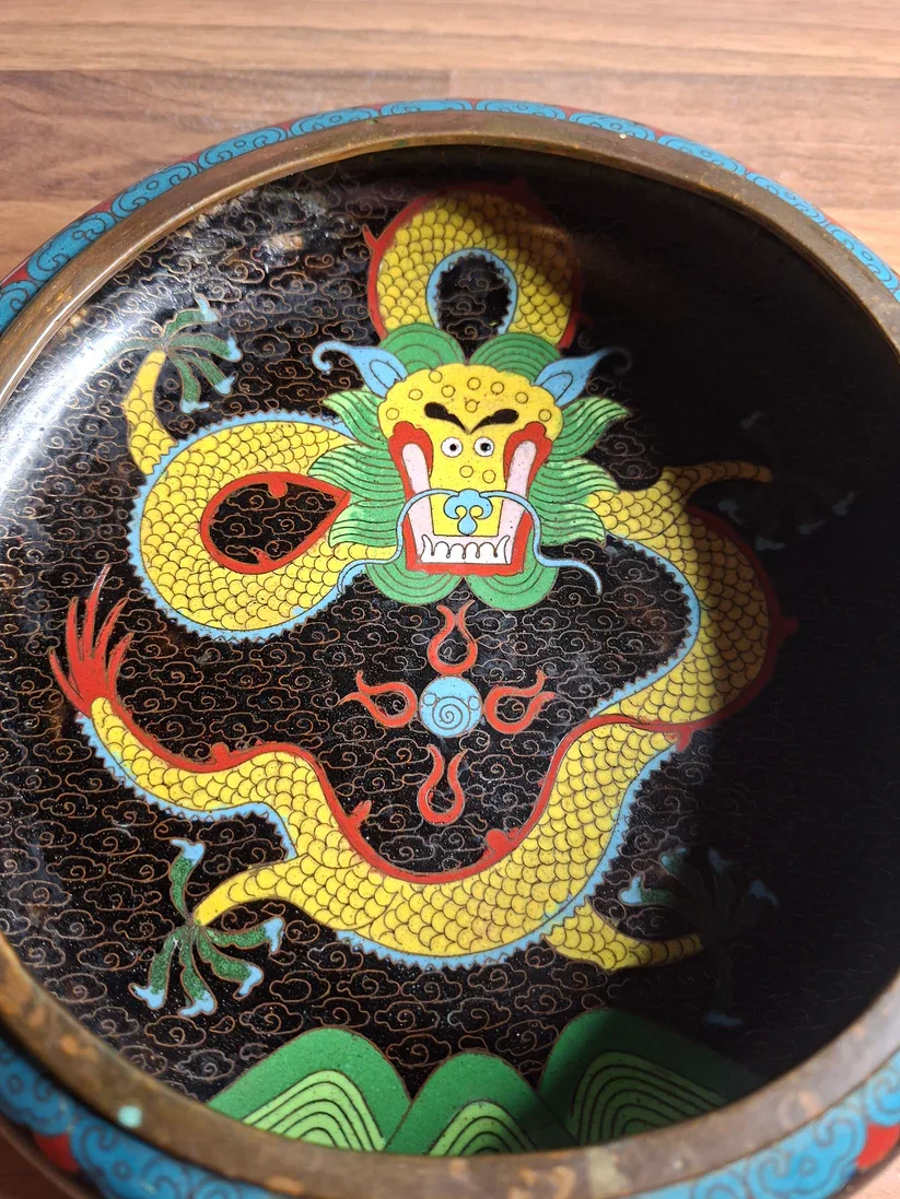 Detailed view of a Chinese dragon bowl that dates to the early 20th century and showcases the bold artistry of traditional cloisonné enamelling.