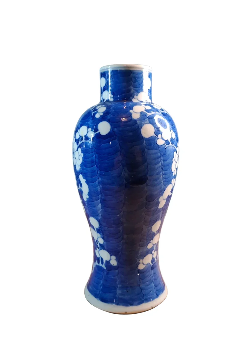Chinese porcelain vase, standing 23cm in height, is beautifully decorated in the Qing Dynasty Kangxi style, featuring the classic Prunus pattern executed in rich underglaze blue.