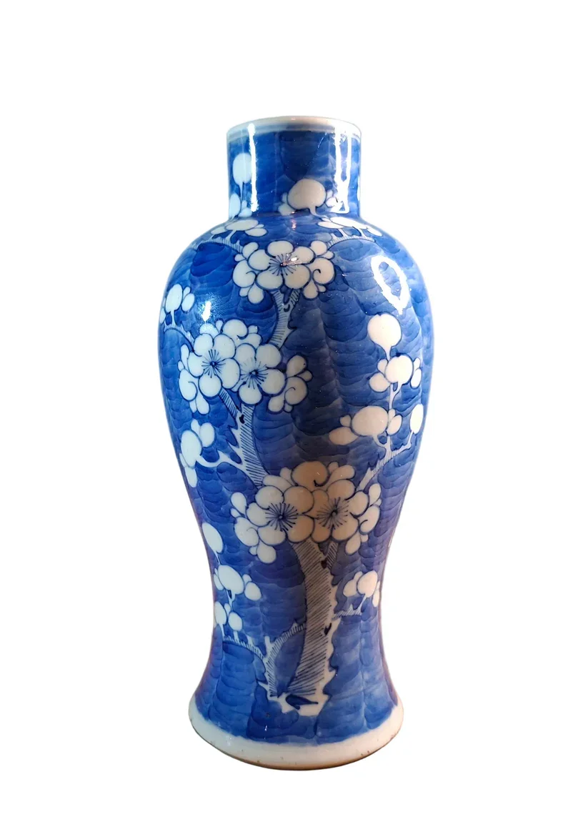 Chinese porcelain vase, standing 23cm in height, is beautifully decorated in the Qing Dynasty Kangxi style, featuring the classic Prunus pattern in underglaze blue.