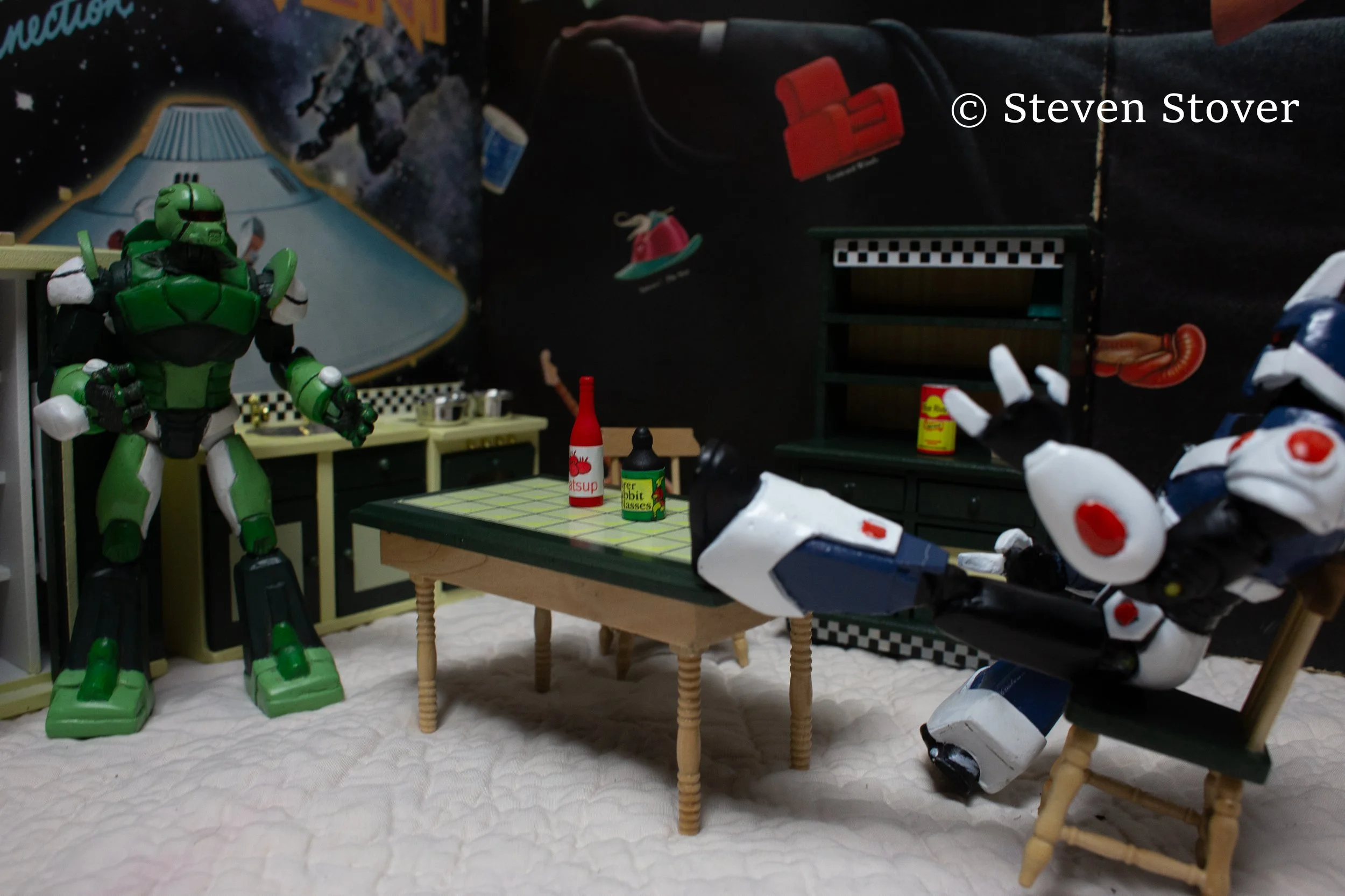 Full shot of Hater Bot. This model was very delicate. Def not my favorite for filming. It felt more like a show model. He was not built for standing. Likewise, Sheek was not built for sitting.  WTF is catsup?