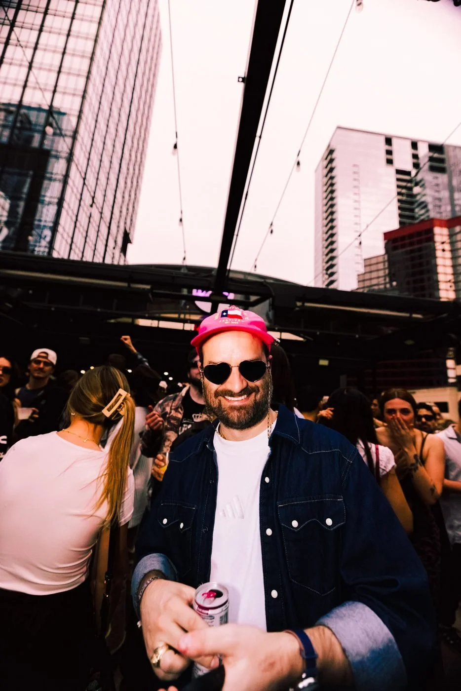 DJ and crowd on Twins Rooftop above 4th Street