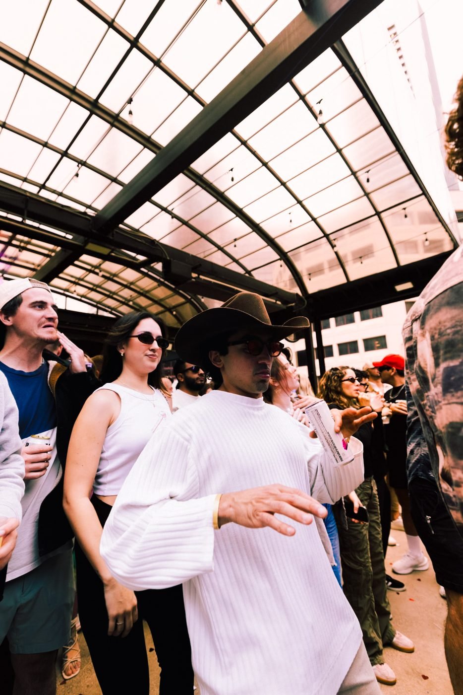 Crowd under the open roof at Sunset Sessions
