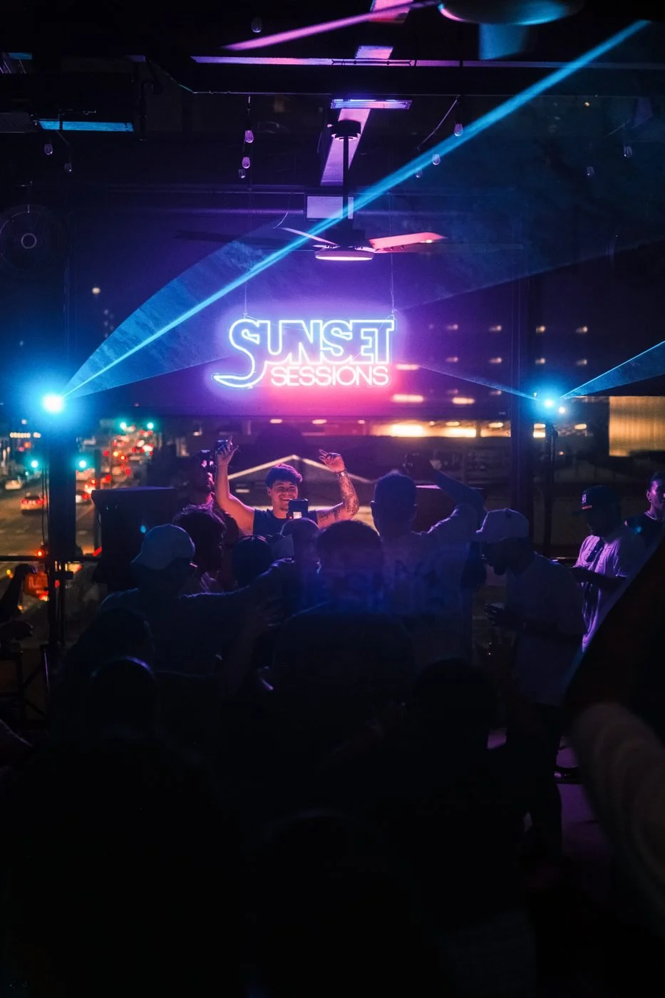 Sunset Sessions crowd after dark on Twins Rooftop
