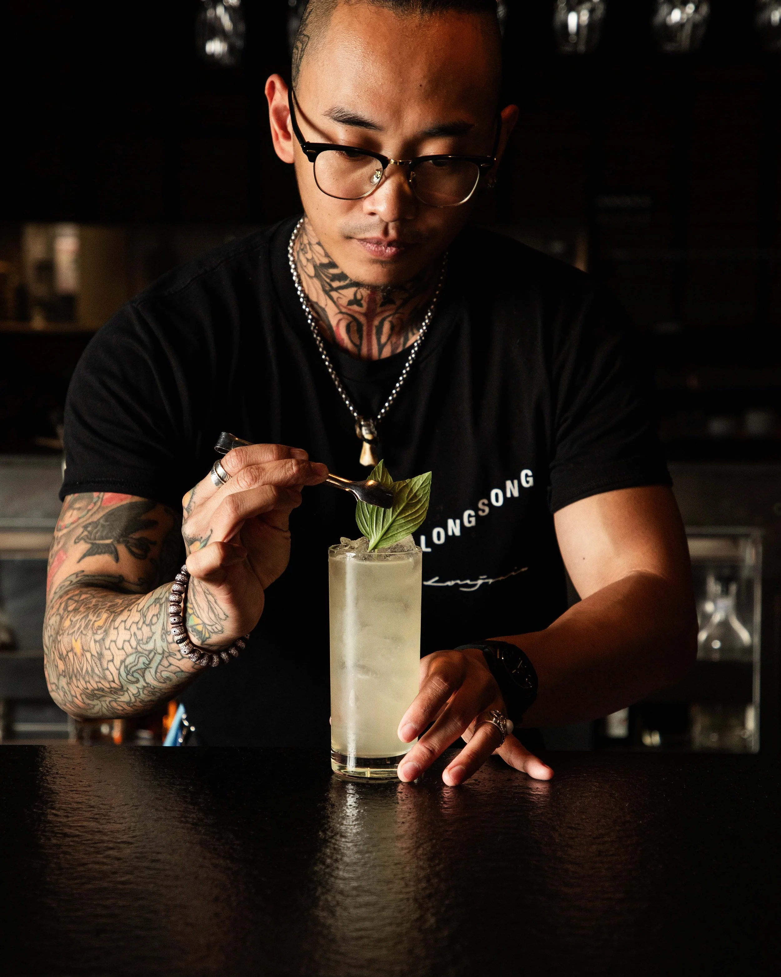 A Longsong bartender making a cocktail