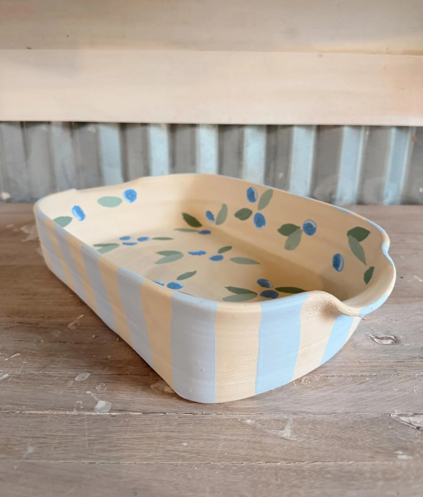 I&rsquo;m just gonna keep painting spring themed pieces to get us through these snow days 😭 chilled to the bone over here! 

#pottery #casserole #blueberry #handmade #ceramics